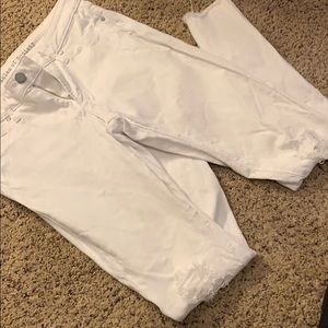 Distressed white skinny jeans